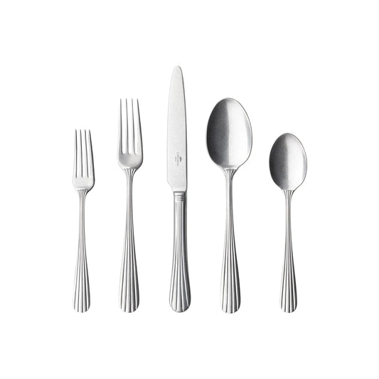 Five pieces of Costa Nova “Douro” stainless flatware—a salad fork, dinner fork, knife, tablespoon, and teaspoon with matching handles—are arranged side by side on a white background.
