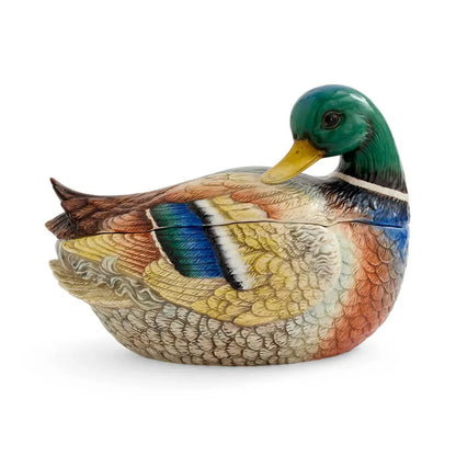 The Spode Woodland Mallard Lidded Server by Spode is a ceramic casserole dish charmingly shaped and painted like a mallard duck, featuring lifelike details in brown, blue, green, and white with the head turned slightly to the side. This elegant countryside server brings rustic sophistication to your table.