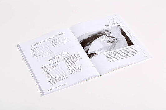 Open spread of The Knot Ultimate Wedding Planner showing checklist and wedding ring photography page