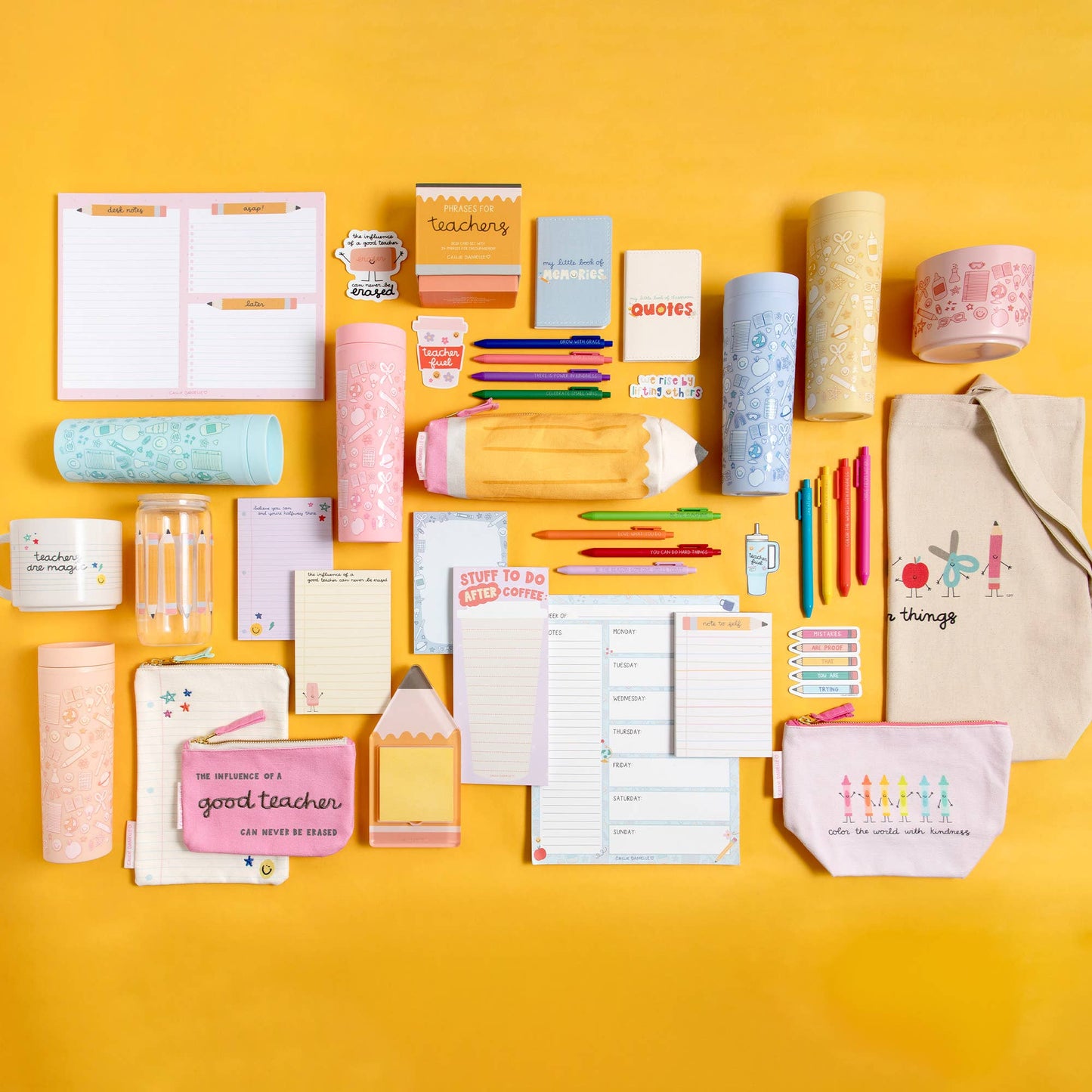 Colorful stationery items—including notebooks, pens, pencil cases, bottles, the Callie Danielle - Pencil Sticky Note Holder by Callie Danielle, and a beige tote bag—are arranged neatly on a bright yellow background, making them a perfect cheerful back-to-school gift.