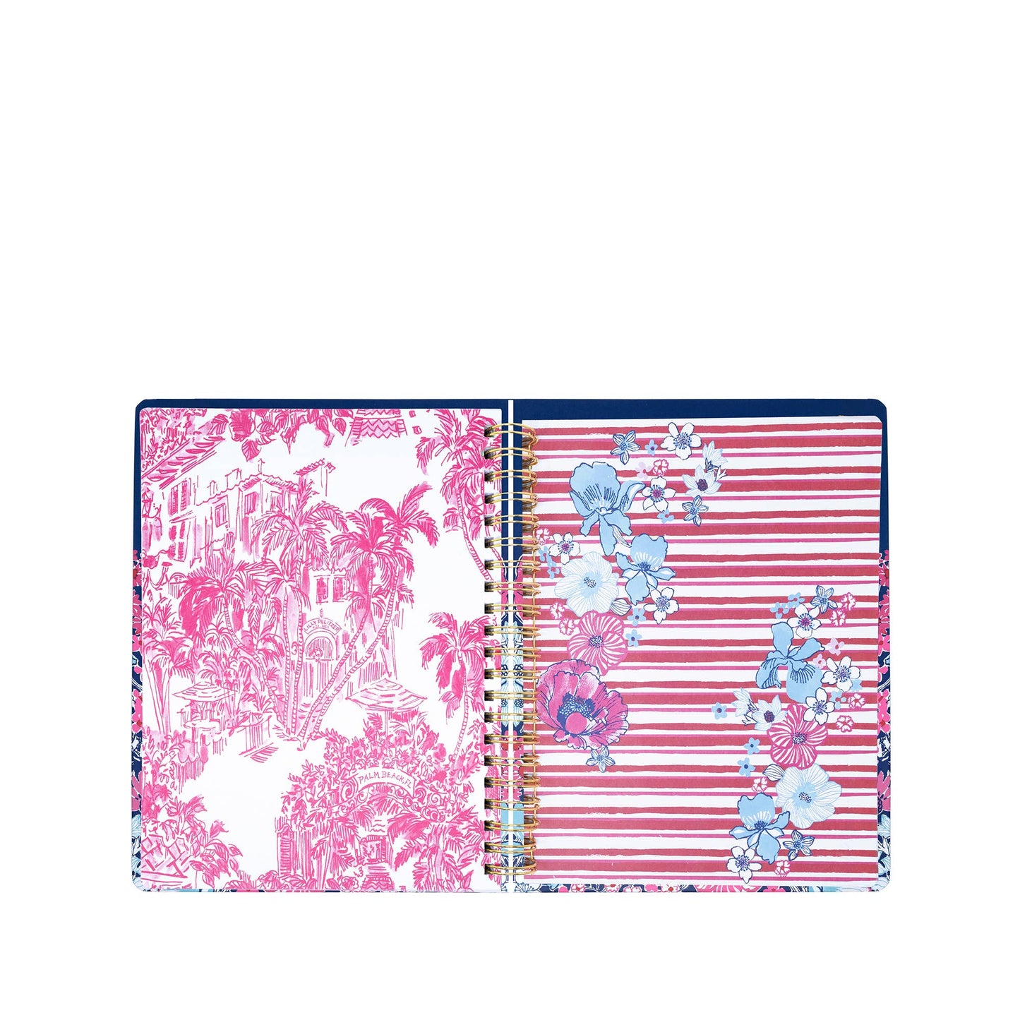 The Lilly Pulitzer by Lifeguard Press - Jumbo 17 Month Agenda, In All Her Glory, is an open spiral-bound planner displaying a page with pink tropical landscape art and another featuring pink stripes accented with blue, white, and pink floral designs.