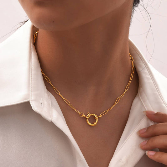 JOSSLYN by wall to wall 18K Stainless Steel Circle Necklace worn with gold chain link and textured ring pendant
