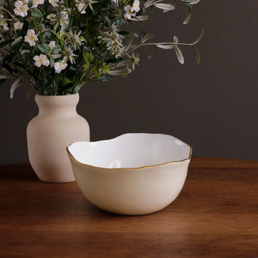 Beatriz Ball Encanto Osaka Large Bowl in cream and white with gold rim, displayed on wood table