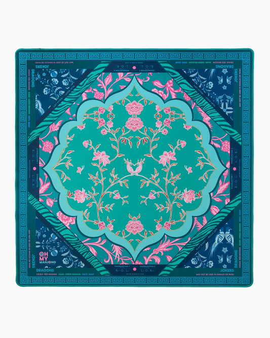 Oh My Mahjong Esme Mat featuring teal center with pink floral motif, navy blue border, and geometric pattern