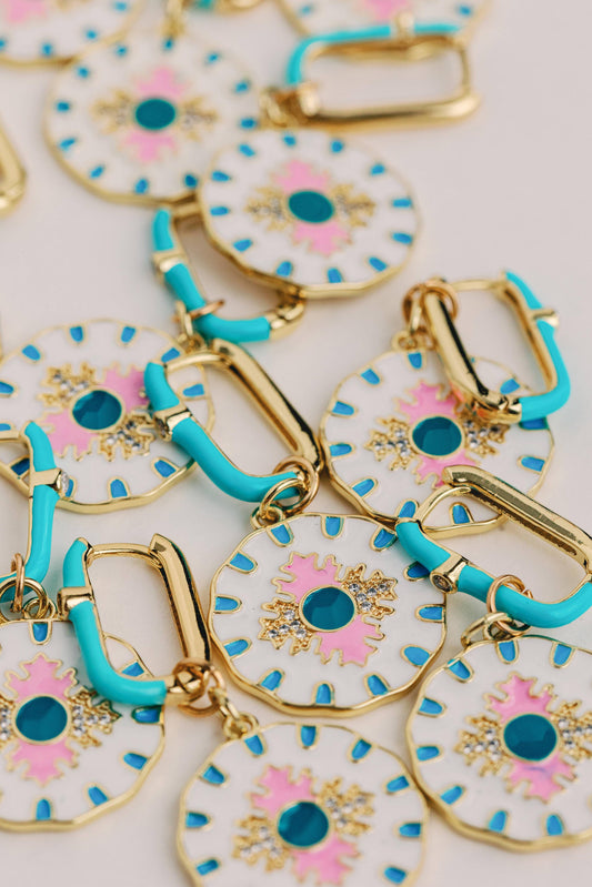 St Armands Designs Capri Tile enamel charm earrings with turquoise hoops and white disc charms featuring pink flowers, blue dots, and gold accents