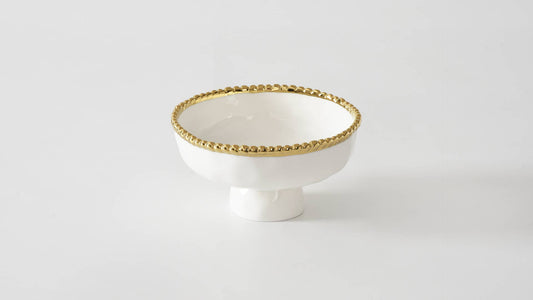 Pampa Bay Small Footed Bowl in cream with gold beaded rim, front view