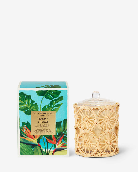 Glasshouse Balmy Breeze 13.4 oz candle in cream textured jar with tropical leaf patterned turquoise box