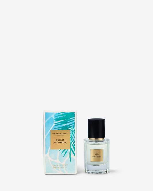 Glasshouse Sunlit Saltwater eau de parfum 30mL clear glass bottle with gold label and black cap, turquoise leaf patterned box