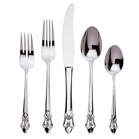 Five pieces of Ginkgo "Fleur De Lis" Stainless Flatware by Gingko—salad fork, dinner fork, knife, soup spoon, and teaspoon—each featuring ornate, decorative handles with a fleur-de-lis motif, are arranged side by side on a plain white background.