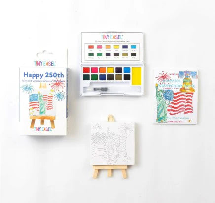 Tiny Easel Happy 250th paint set contents displayed including watercolor palette, paint brush, coloring pages, and miniature easel with wooden legs