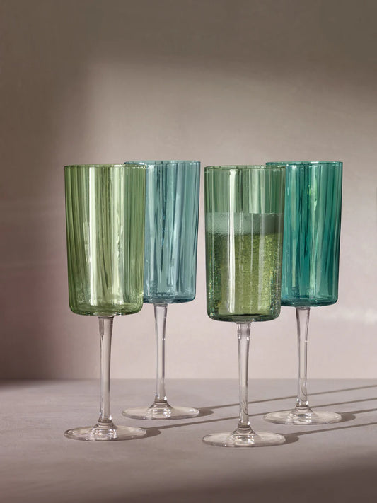 Set of four LSA Gems champagne flutes in jade green and pale blue with vertical ribbed texture