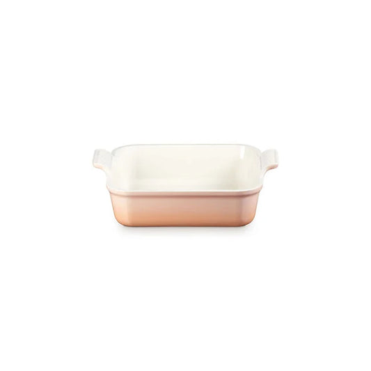 Le Creuset Heritage Square Dish in shell pink with cream interior and clear handles