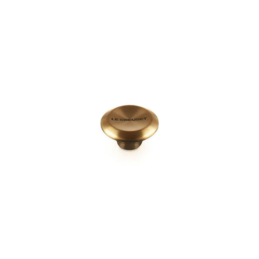 Le Creuset Signature stainless steel knob in brushed gold finish with engraved branding