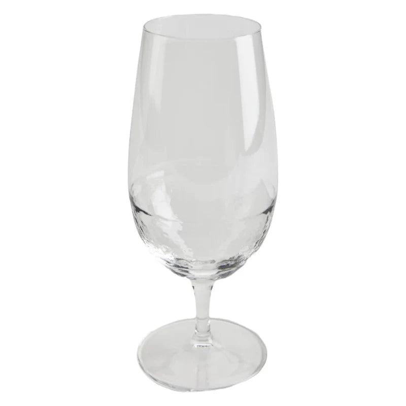 A transparent Tableau "Monte" water glass by Tableau, featuring a long stem and a wide base, is displayed against a plain white background.