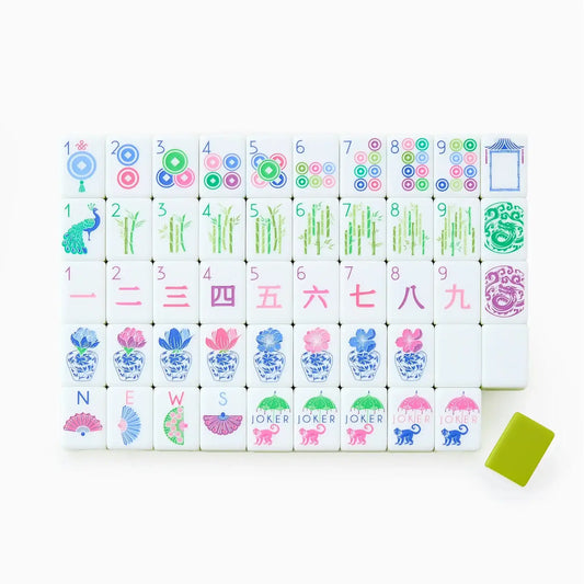 Oh My Mahjong Limoncello tile set with colorful hand-painted designs, lime green rack, laid out for display