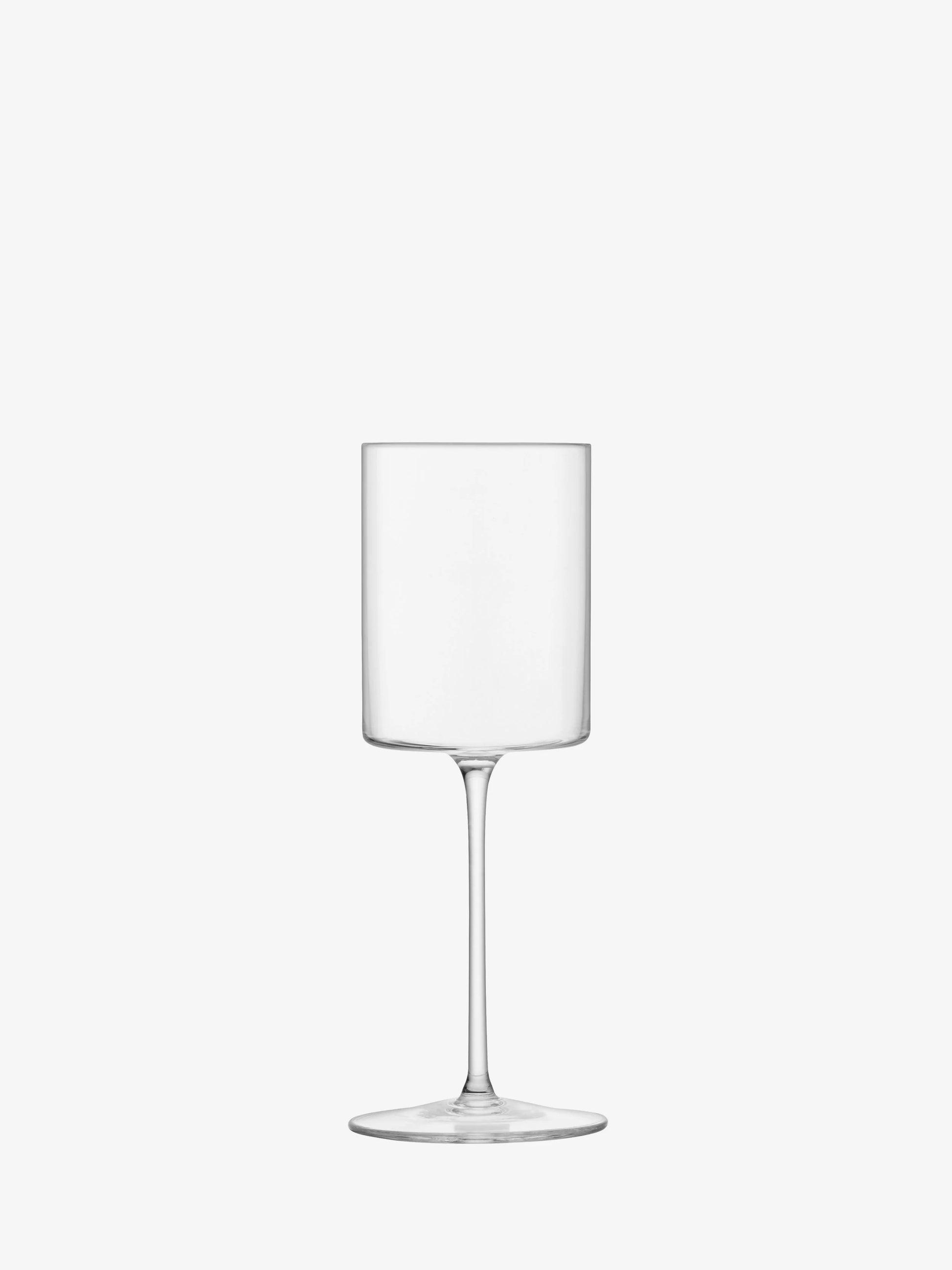 The LSA "Otis" White Wine Glass by LSA is a clear, cylindrical handmade stemware piece with a tall stem and a flat, round base, shown against a plain white background.