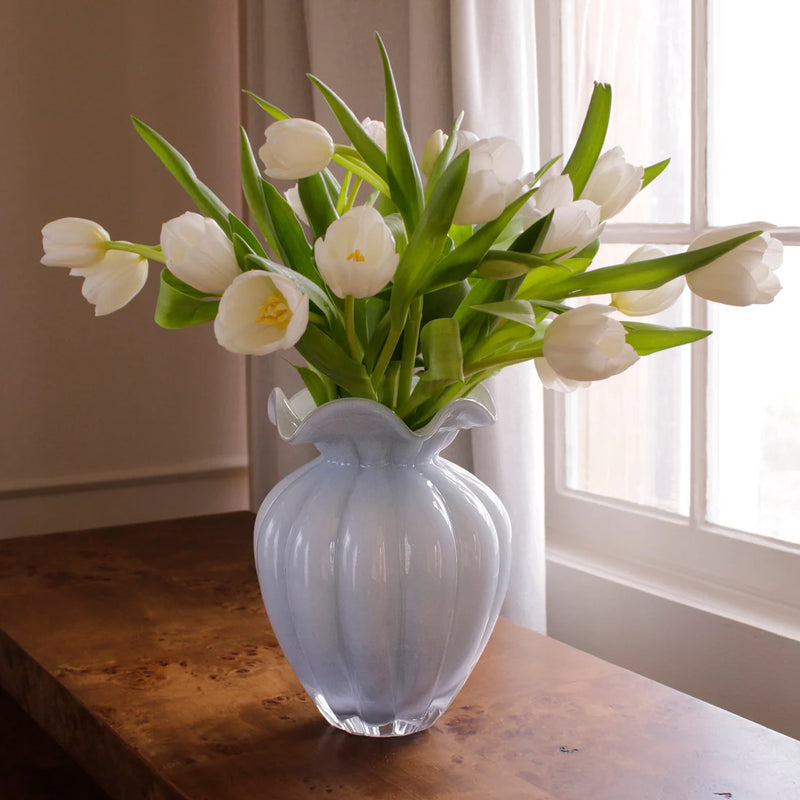 Beatriz Ball Vento large bud vase in frosted clear glass filled with white tulips