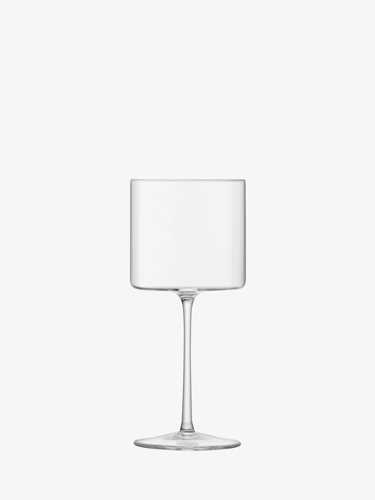 The LSA "Otis" Red Wine Glass by LSA features a clear, empty bowl with a cylindrical shape and an elongated stem, set against a plain white background—exquisitely handcrafted stemware that brings artisanal elegance to any table setting.