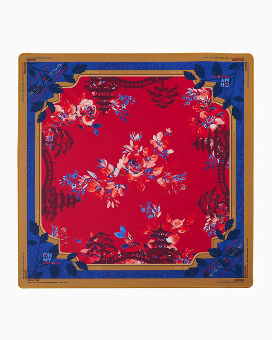 Oh My Mahjong Scarlett Mat with red center, blue border, tan edges, and colorful floral design throughout
