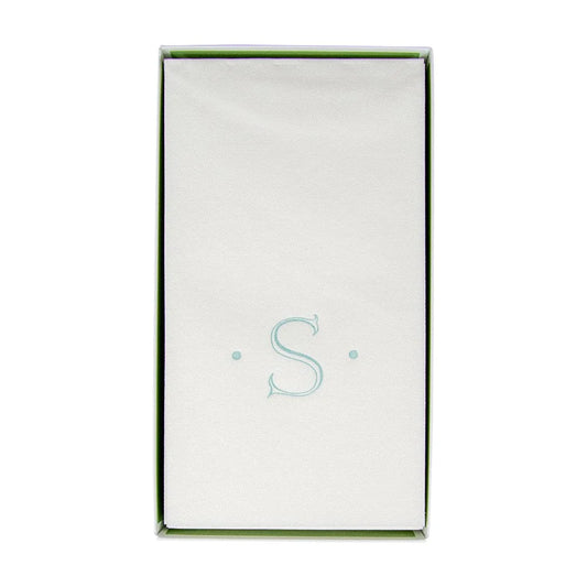Caspari Antique Initial Guest Towel with light blue letter S monogram in packaging with green trim