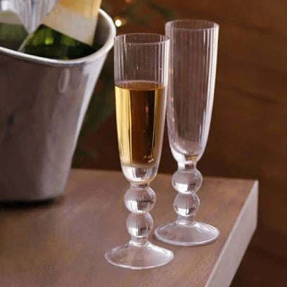 Beatriz Ball Venice Champagne Flute Set of 4 in clear glass with beaded stems, two flutes shown