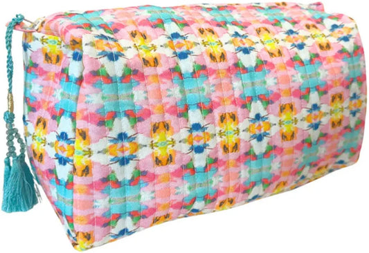 Laura Park quilted cosmetic bag in multicolor geometric pattern with turquoise tassel, front view