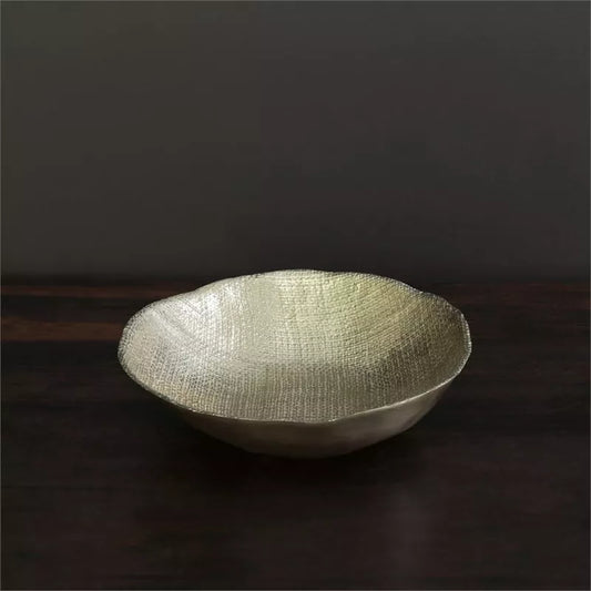 Beatriz Ball Sierra Chelsea Bowl in gold with textured interior, side profile on dark surface