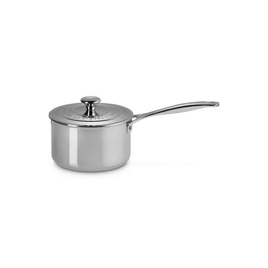 Le Creuset Signature stainless steel 3qt saucepan with lid and long handle, angled view