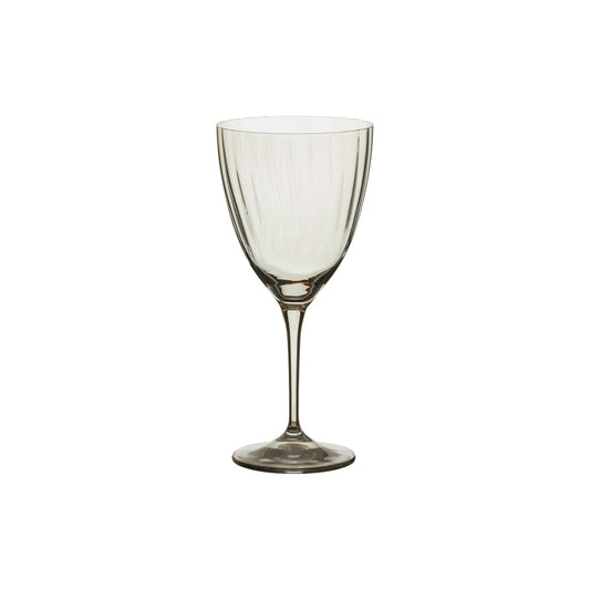 The Casafina "Sensa" Smoke Grey Magnolia Wine Glass by Casafina features a long stem and a gently flared bowl, elegantly photographed against a plain white background.